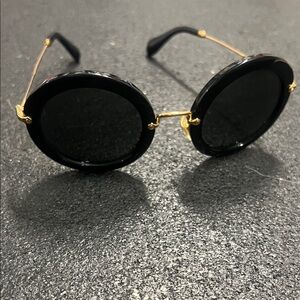 Miu Miu Black Round Women's Sunglasses with Gold Accents